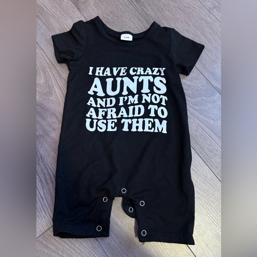 Black Baby One-Piece Bodysuit with 'I Have Crazy Aunts' Slogan